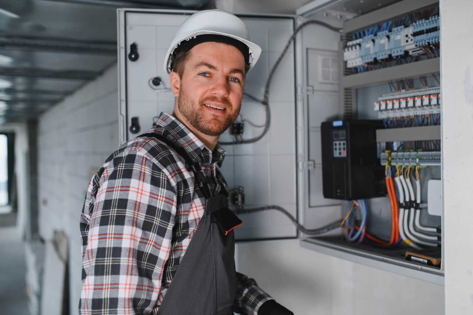 Mike Simons, NICEIC-certified electrician working on a consumer unit in Chester